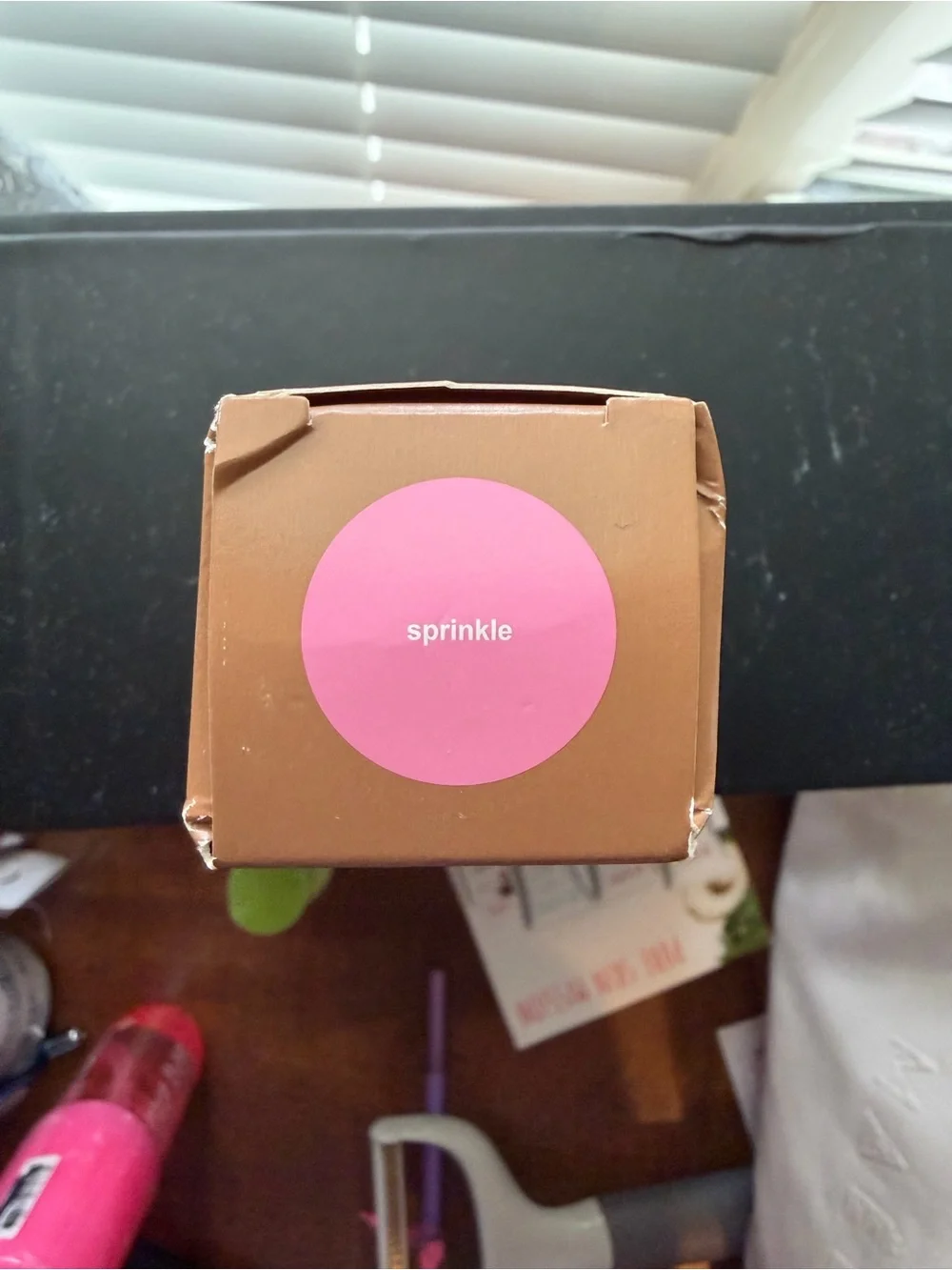 RHODE Satin Buildable Color in Brown Packaging with Pink Accent